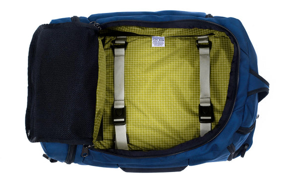 An open Techonaut 30 with a Navy exterior and an Wasabi (pea green) interior.